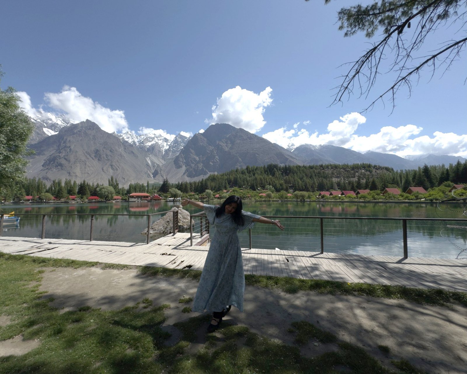 Kashaf by a lake with mountains behind her