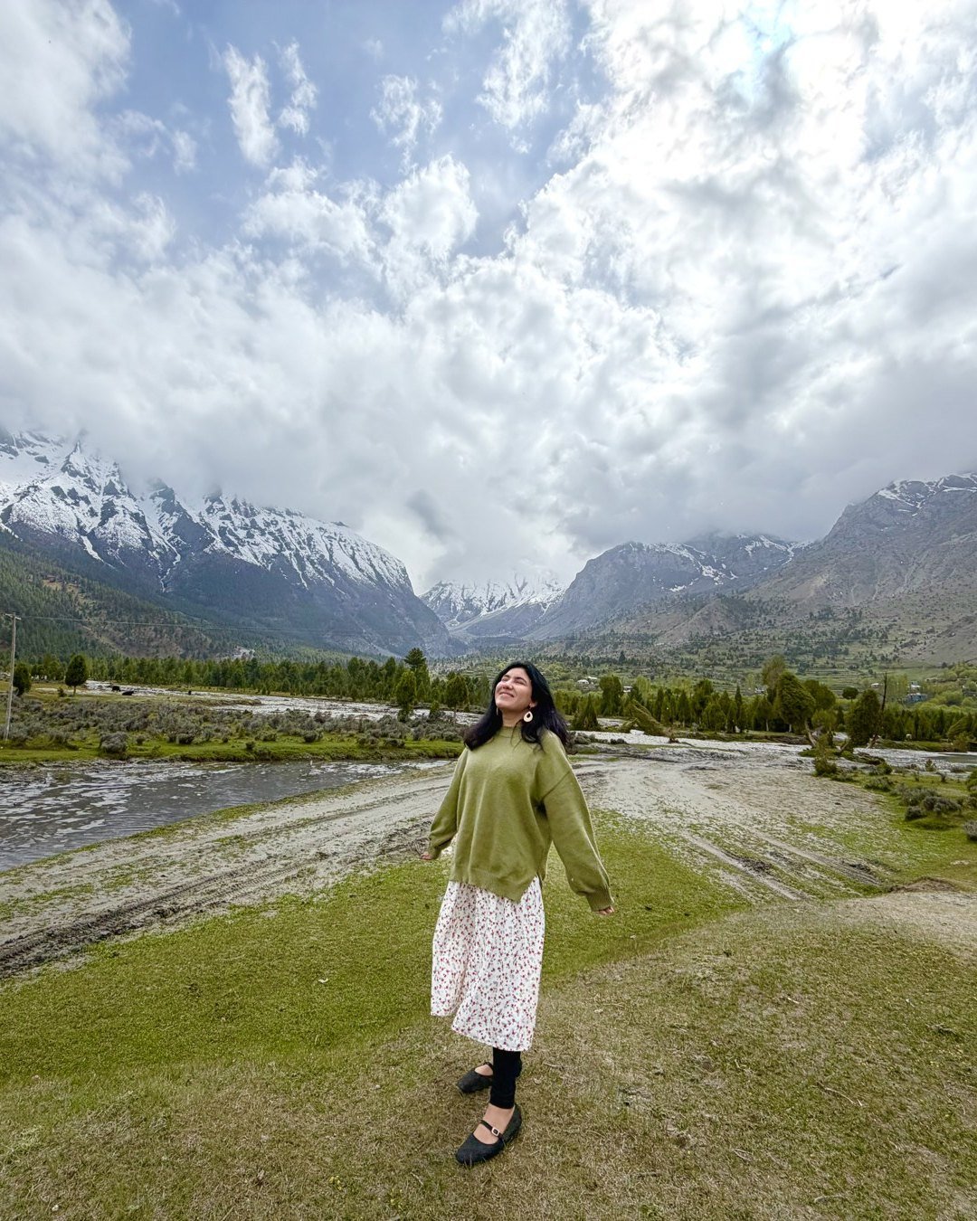 Kashaf standing in front of snow-capped mountains